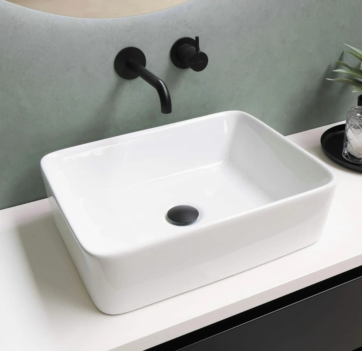 Modern rectangular bathroom sink with matte black faucet and drain. Bathroom Remodeler Laguna Niguel