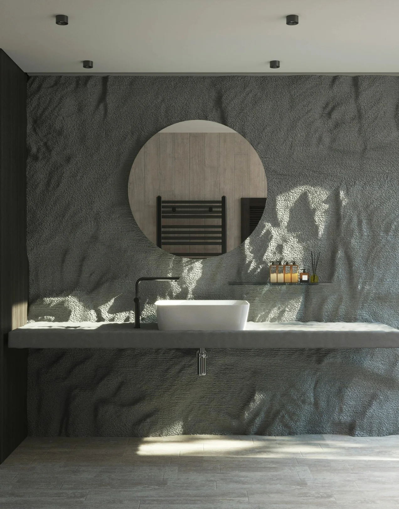 Modern bathroom with stone wall, round mirror, and vessel sink. High-end bathroom renovation in Mission Viejo.