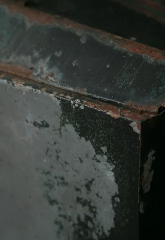 Close-up of rusted metal box, potentially related to water damage restoration in San Juan Capistrano.